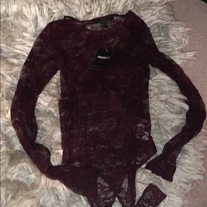 New never worn lace body suit with tags!